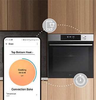 Smartphone app shows cooking time and temperature, synced with a built-in LG oven in a modern wooden kitchen.