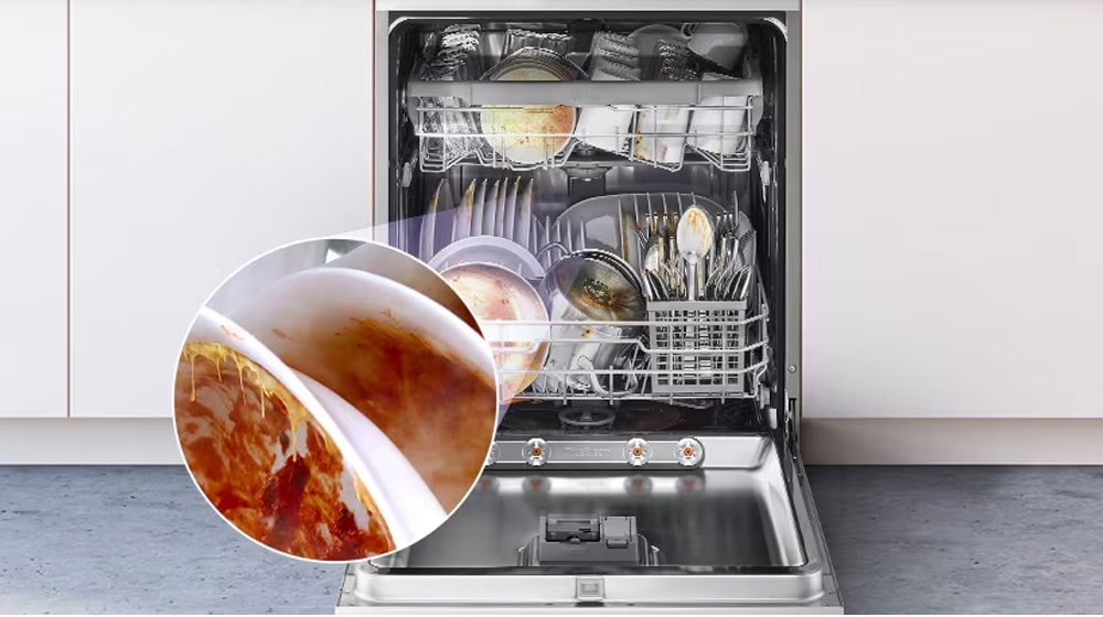 A free-standing dishwasher with the door fully open, revealing dirty dishes inside.