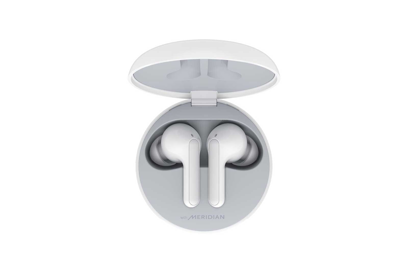 A top view of a cradle opened up and two earbuds inside it with UV lighting on