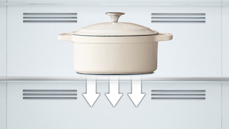 heavy metal pot on a shef that is inside of LG bottom freezer refrigerator.