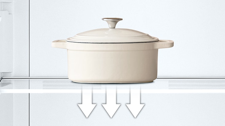 Tempered glass shelf holding heavy pot inside refrigerator, showing its strength and easy-to-clean surface