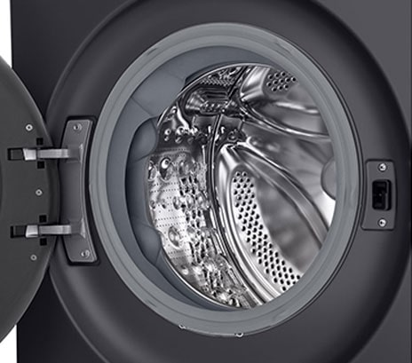 Close-up of the washing machine drum with the door open