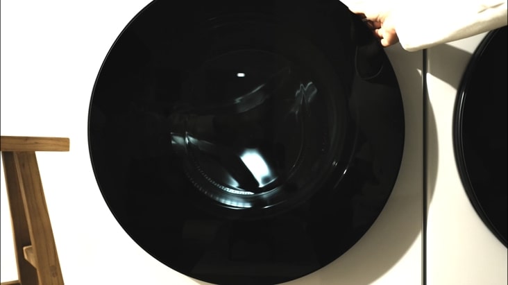 A video of opening the door, loading laundry into the spacious drum, and powering on the machine.