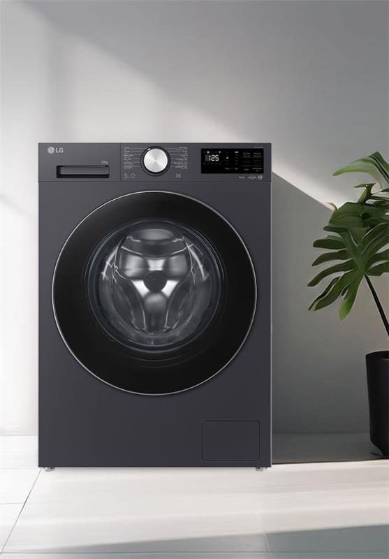 Front-load washing machine placed in a modern laundry space