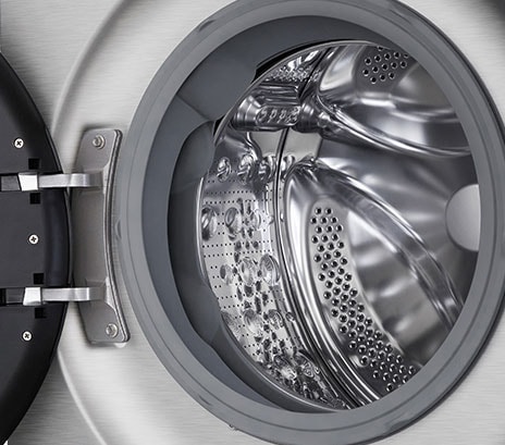 Close-up of the washing machine drum with the door open