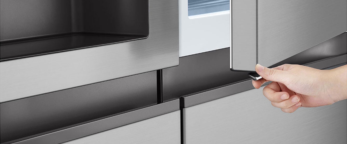 Someone is opening the door of refrigerator using the Door-in-Door™ button