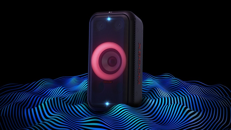 LG XBOOM XL5S is standing on the infinite space. Red woofer lighting and double strobe lightings are on. On top of the speaker a sound eq is displayed. Sound waves are coming out from the bottom of the speaker in order to emphasize its deep bass.