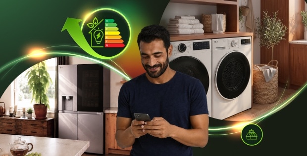 Un hombre con un smartphone frente a electrodomésticos LG y gráficos sobre eficiencia energética.