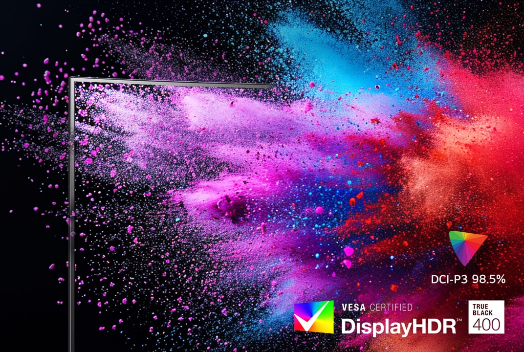 Monitor LG mostrando explosiones de polvo rosa y azul ilustra el brillo HDR y la gama cromática DCI-P3.