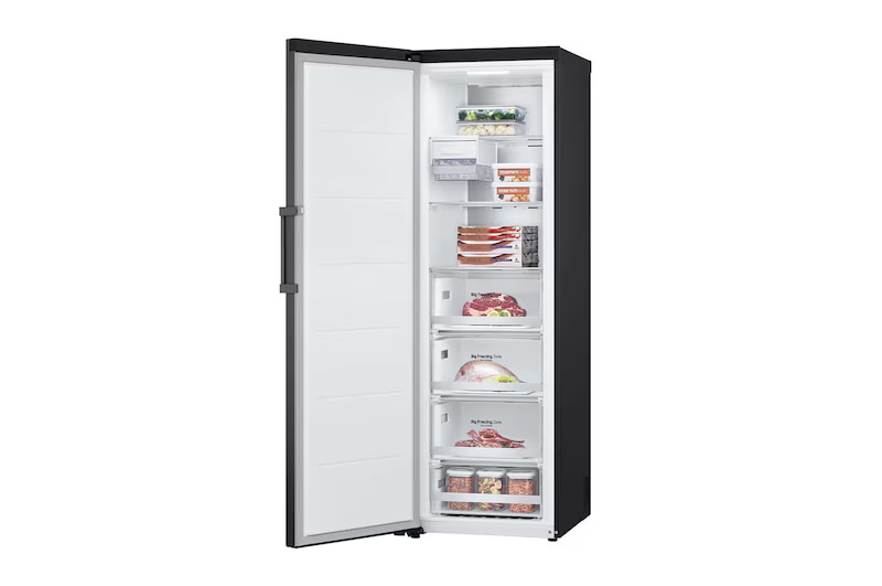 A tall refrigerator with the fridge on top and freezer below, opened to show food items and bottled drinks arranged on shelves and in drawers.
