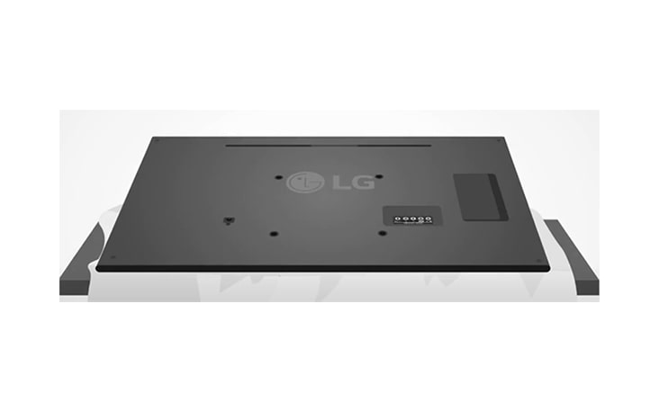 Coloca un cojín o un paño suave en una mesa y colocar el monitor sobre él, con la pantalla hacia abajo