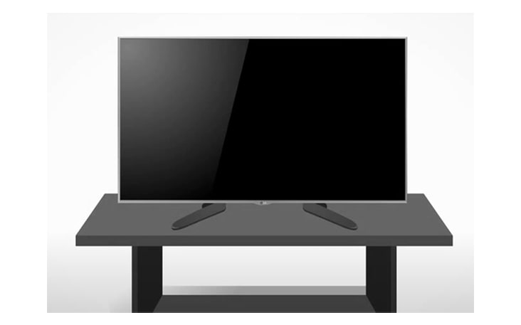 Coloca un cojín o un paño suave en una mesa y colocar el monitor sobre él, con la pantalla hacia abajo