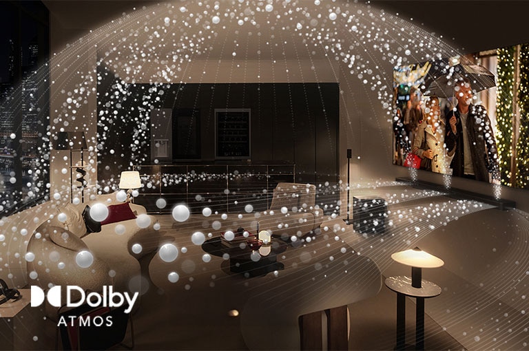 Una película se reproduce en un televisor OLED LG y una barra de sonido LG en un moderno apartamento de la ciudad en una vista lateral. Las perlas blancas que representan ondas sonoras se proyectan hacia arriba y hacia abajo desde la barra de sonido y el televisor, creando una cúpula de sonido en el espacio.
