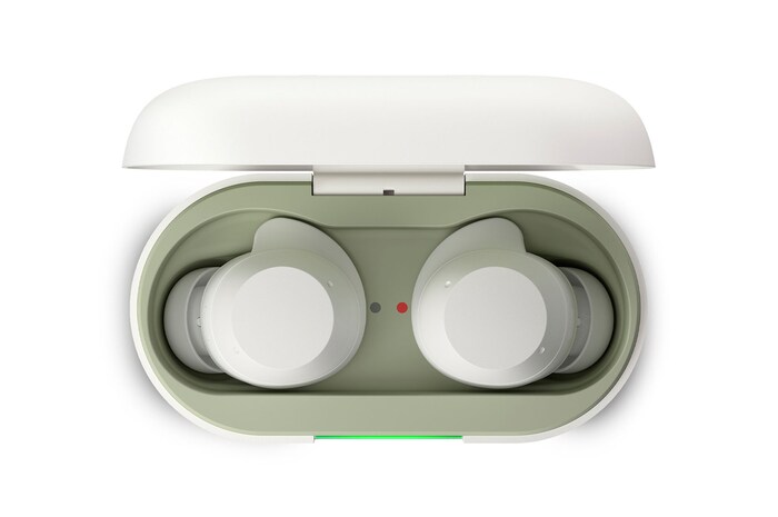 opened cradle top view with earbuds