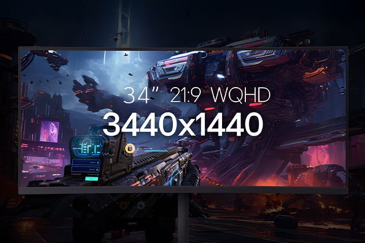 Un monitor de 34 pulgadas 21:9 WQHD que muestra una escena futurista de batalla con enormes máquinas robóticas en una ciudad de ciencia ficción..