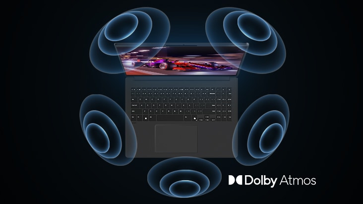 La imagen muestra una vista cenital de un portátil con un gráfico vibrante en tonos púrpura en la pantalla. Alrededor del portátil aparecen visuales dinámicos de ondas de sonido, que indican una experiencia de audio envolvente. En la esquina inferior derecha se muestra el logotipo de ‘Dolby Atmos’