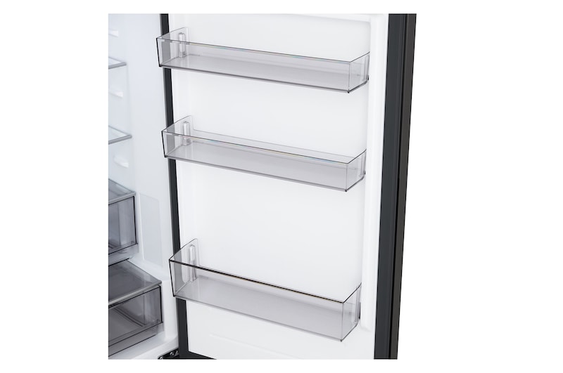 LG fridge freezer (GBBSJ10DEP) built into dark brown cabinetry with window and sofa on left and sink on right