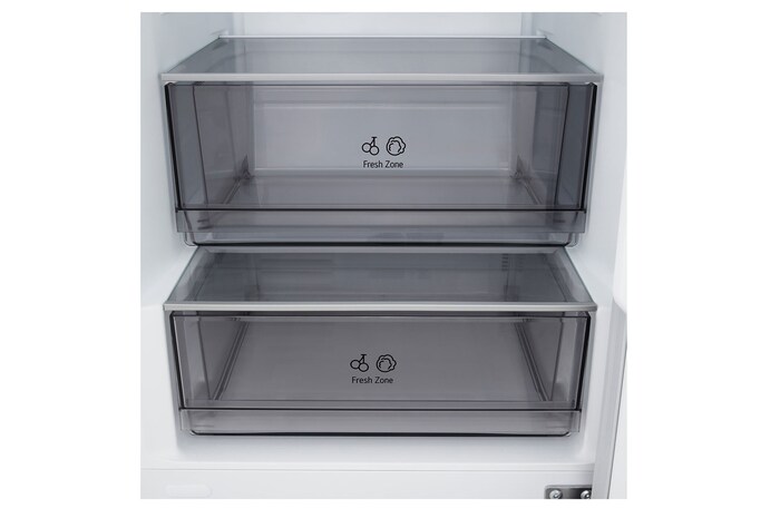 LG fridge freezer (GBBSJ10DEP) built into dark brown cabinetry with window and sofa on left and sink on right