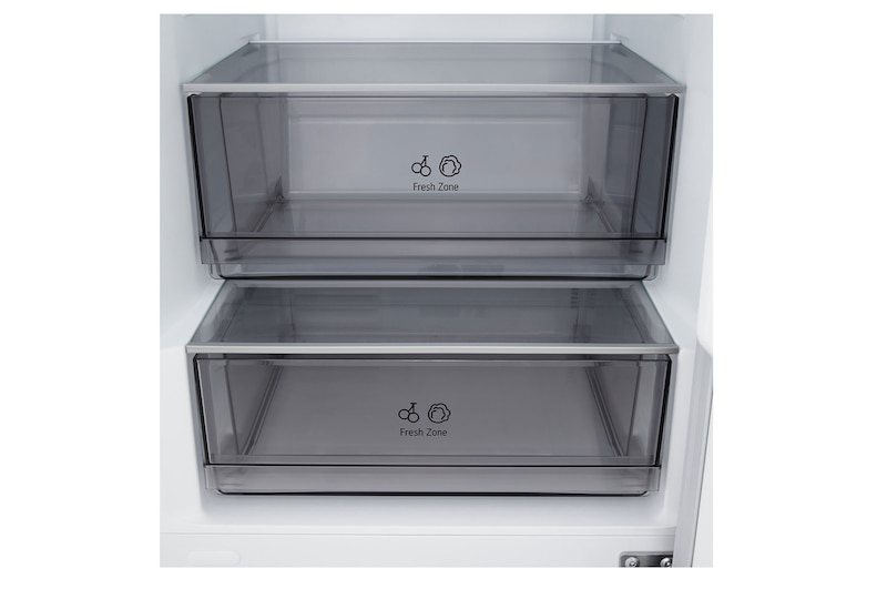 LG fridge freezer (GBBSJ10DEP) built into dark brown cabinetry with window and sofa on left and sink on right