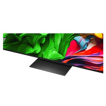 Splashes of paint burst from the floor up in red, orange, yellow, green, blue, and purple. Short text describes how LG’s color gamut technology replaces Quantum Dot to provide enhanced color reproduction rate. 