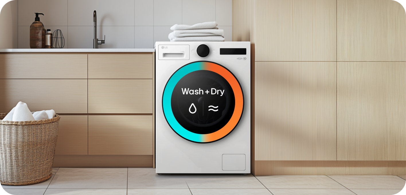 A white all-in-one washer dryer with a circular display showing the text “Wash + Dry,” installed in a laundry area next to wooden cabinets.