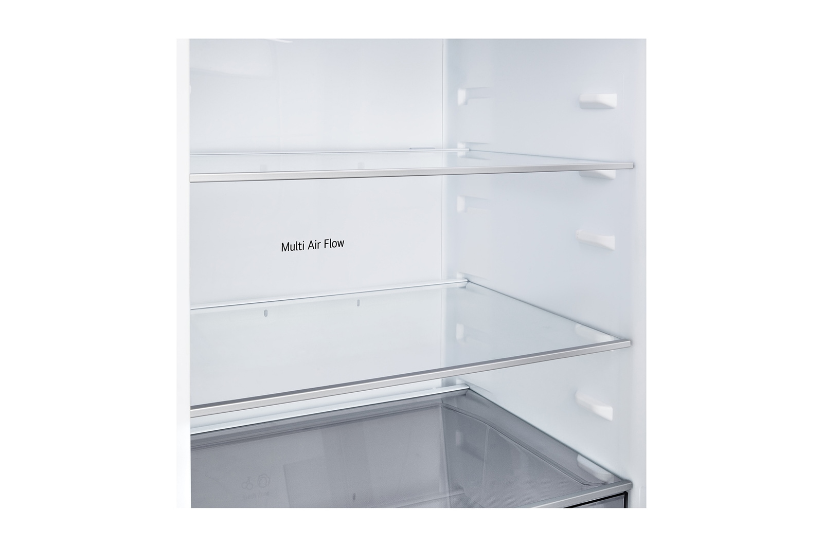 Congélateur bas LG (gbbsj20dpy) installé encastré dans un grand mur beige chaud avec des flèches blanches pointant vers le haut et les surfaces avant