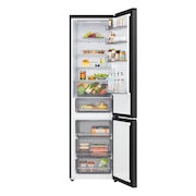 Vue de dessus du réfrigérateur congélateur LG (gbbsj20dpy) avec un réfrigérateur noir mat à gauche et un mur d’armoire à droite