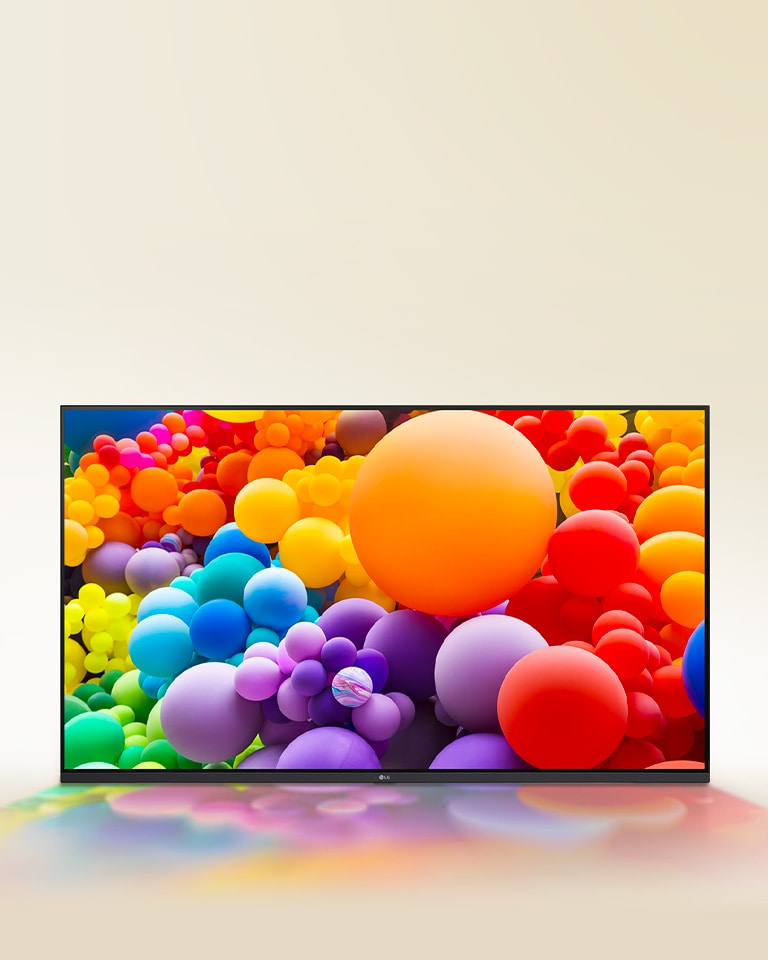 De nombreux ballons de différentes couleurs sont affichés sur un téléviseur LG UHD.