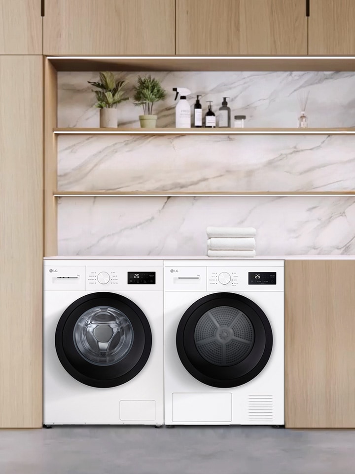 Un lave-linge et un sèche-linge à chargement frontal dans une buanderie