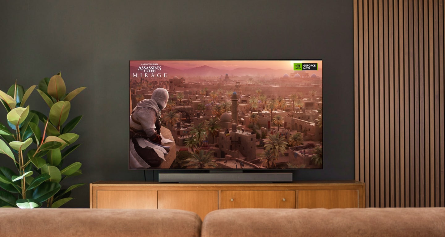 Une grande télévision affichant un jeu avec une scène de dragon vibrant, dans un salon moderne.