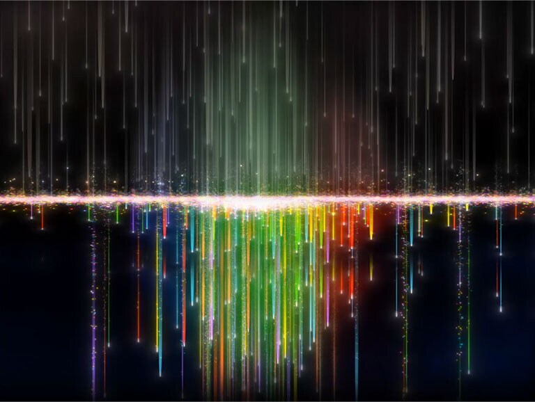 Des pixels multicolores coulent sur un écran en passant au travers des filtres de nanoparticules, les particules en ressortent plus claires et plus nettes.