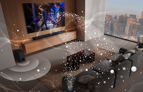 Téléviseur LG, LG Soundbar, enceintes arrière et caisson de basse dans le séjour d’un gratte-ciel, diffusant un spectacle musical. Ondes sonores blanches composées de gouttelettes jaillissant de la barre de son et des enceintes arrières, formant une boucle autour du sofa et dans le séjour. Caisson de basse créant un effet sonore depuis la base.