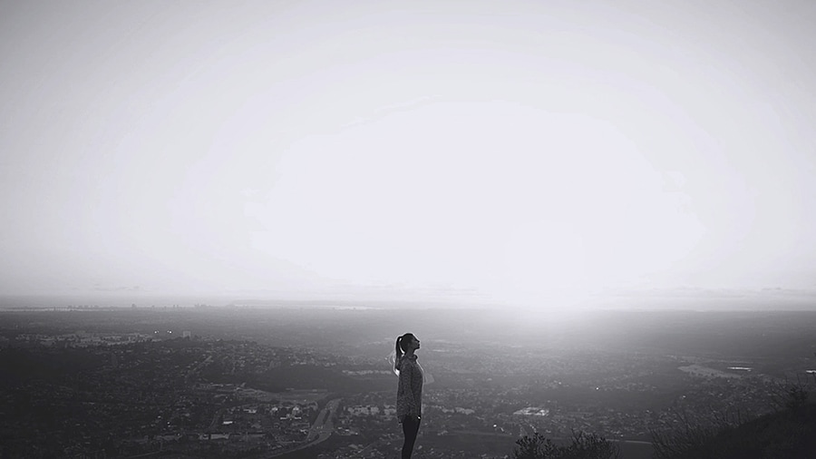 an woman is standing in the field