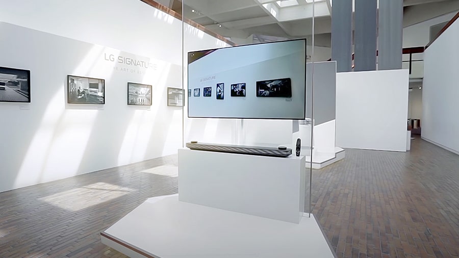 lg signature oled tv is hung on the glass wall at launching event in colombia