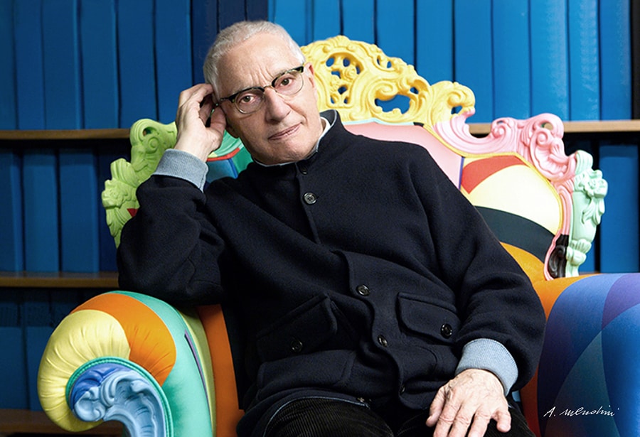 alessandro mendini sitting on a couch and staring forward