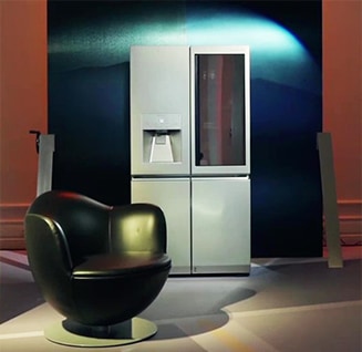 lg signature refrigerator is displayed under the light at the lg signature artweek in spain