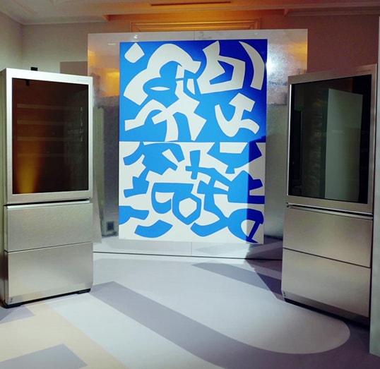 lg signature wine cellars are laid on both side and an art work is displayed at the lg signature artweek in spain