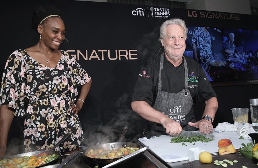 People are cooking in a lg signature kitchen