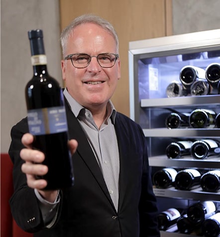 James Suckling recommends a wine in front of LG SIGNATURE Wine Cellar.