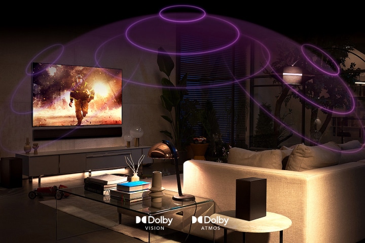 An image of an LG OLED TV in a room playing an action movie. Sound waves create a dome between the sofa and the TV, depicting immersive spatial audio.