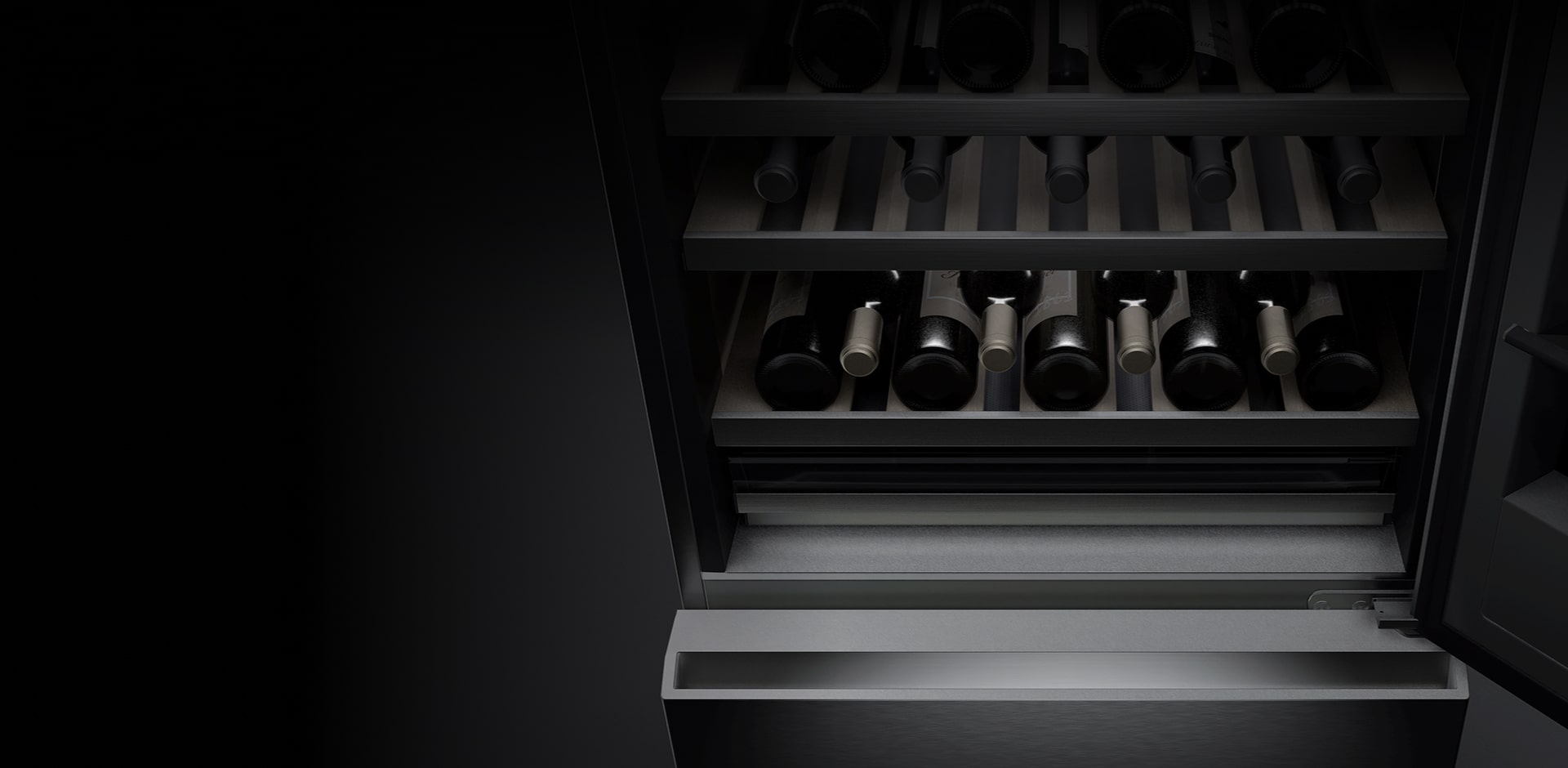 A close-up image of the wine cellar with the door open and several bottles of wine stored on the shelves.