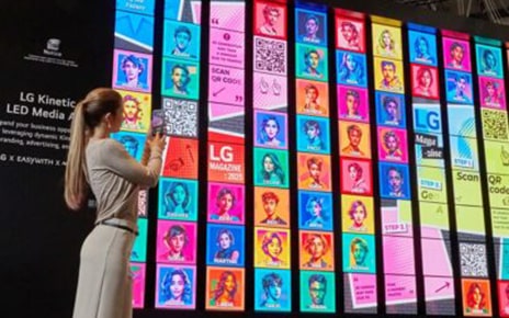LG Kinetic LED Media Art, a dynamic digital wall featuring colorful portraits and QR codes
