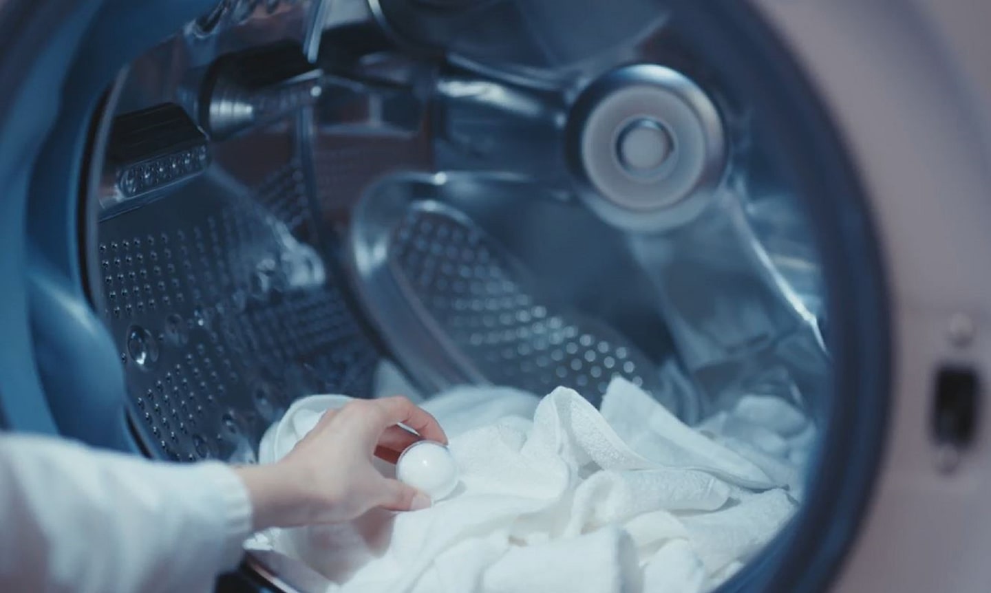 A photo inside a washing machine with laundry