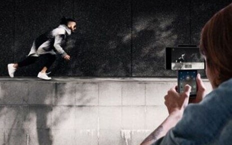 Someone taking a video of their friend doing parkour using LG Wing’s Gimbal Motion Camera to stabilize the picture