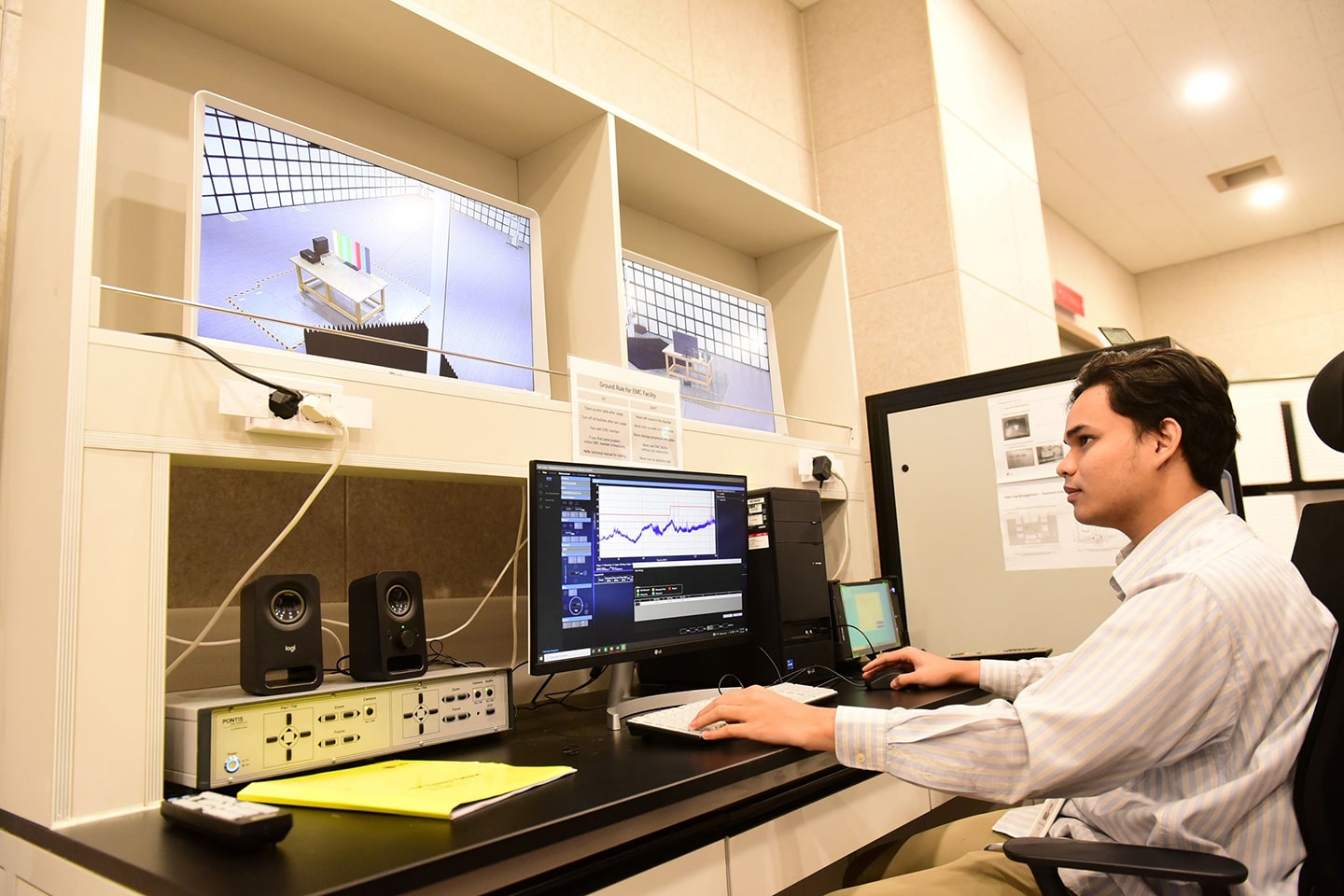A picture of a man analyzing on the computer