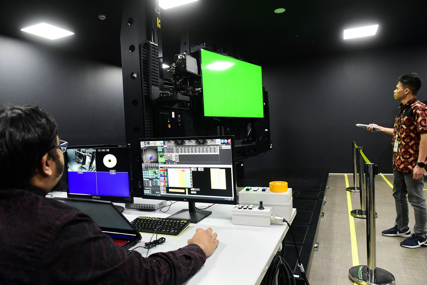 A picture of two people working on projects