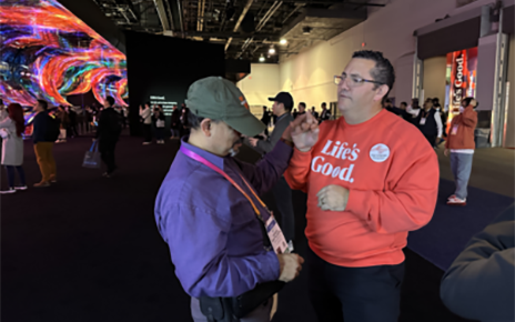 Edward Tory Jarmailo, a sign language interpreter, providing an assistance to visiotors with hearing disabilities