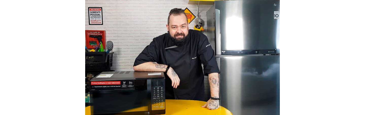 Filipe Nascimento poses with the LG EasyClean microwave oven