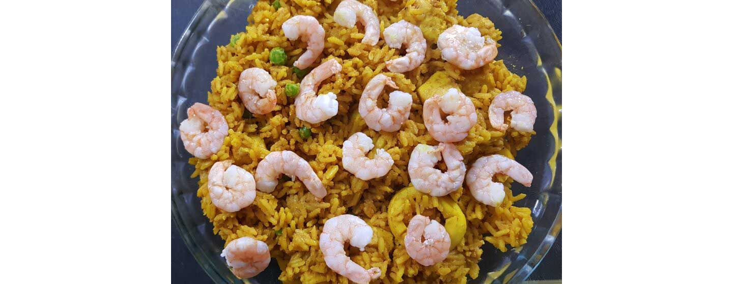A close-up of the shrimp Paella being prepared