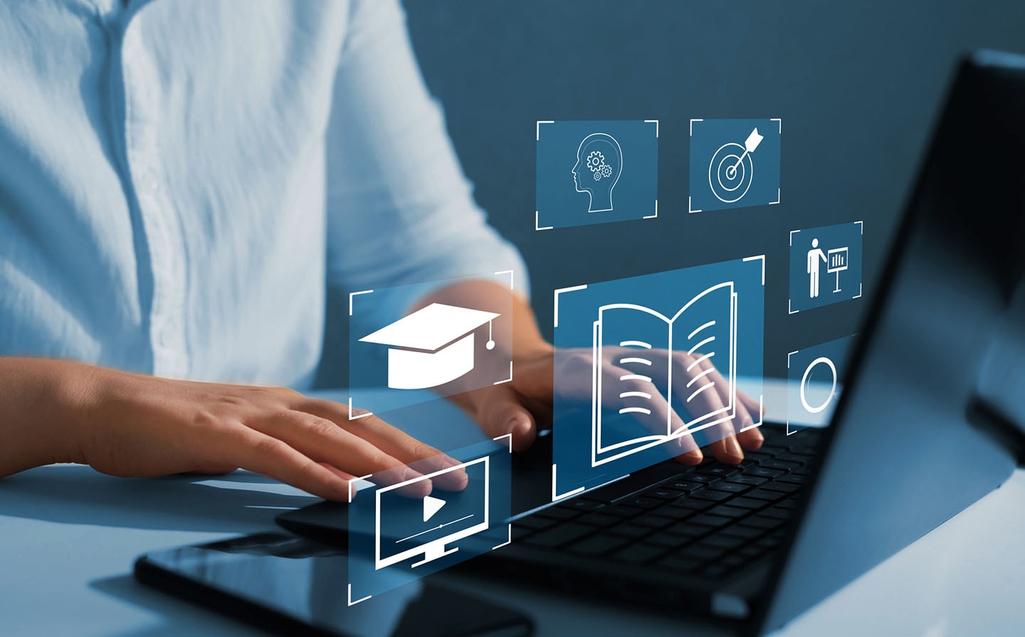 An image of a person doing their computer with different illustrations on top